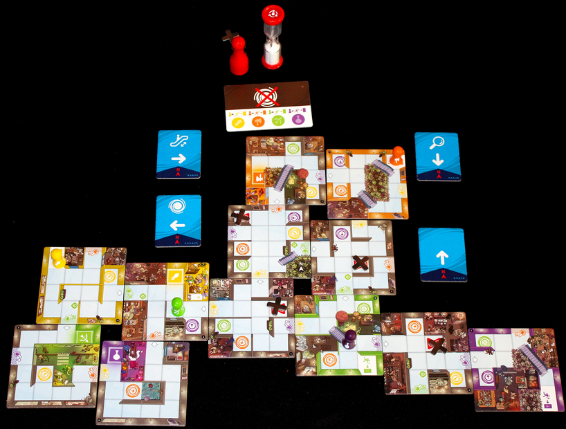 Components of the game, including the hourglass at the top.